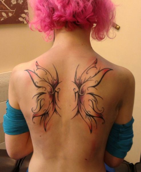 simple wings tattoo on back