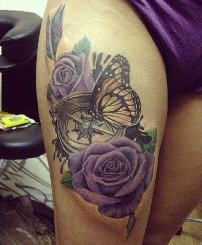 butterfly and flowers thigh tattoo