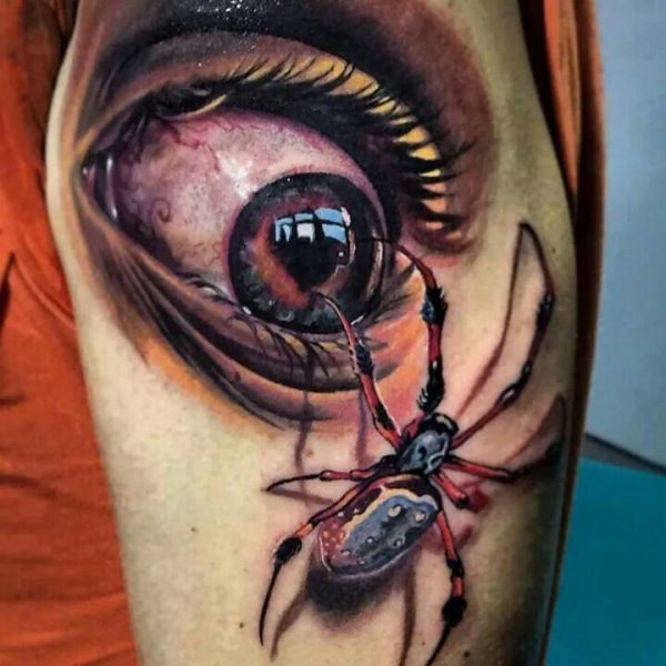 eye with spider tattoo