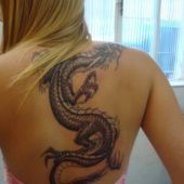 girl dragon back tattoo