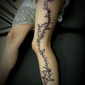 plant leg tattoo