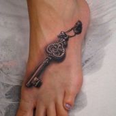 key tattoo on foot