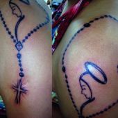 rosary tattoo on arm