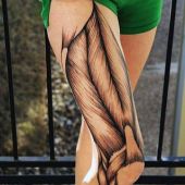 tatuaże damskie mięśnie na nodze