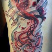 tatuaże damskie phoenix na boku