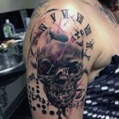 clock and skull tattoos on shoulder