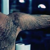 wings man tattoo