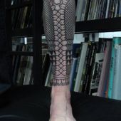 black pattern leg tattoo