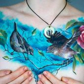 women chest tattoo birds