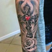 forearm cross tattoo