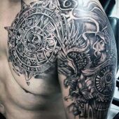 aztec chest and arm tattoo