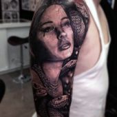 woman with snakes tattoo