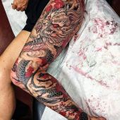 dragon thigh tattoo