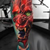 tatuaż demona na łydce