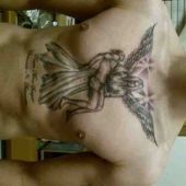 tatuaż Chrystus z aniołem