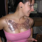 women chest tattoo