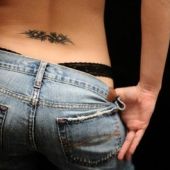 lower back tattoo delicate tribal
