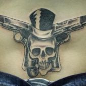 lower back tattoos skull hat gun