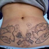 woman stomach tattoo