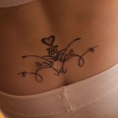 lower back tattoos heart tribal