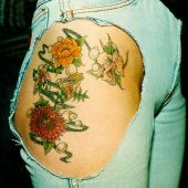 flowers thigh tattoo for girl