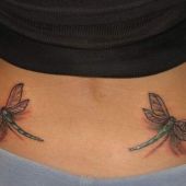 lower back tattoo dragonflys