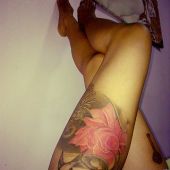 thigh tattoo bird and flower