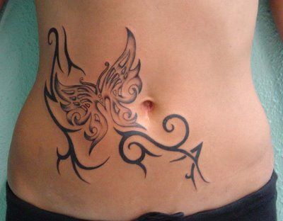 tribal and butterlfy stomach tattoo