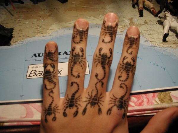 scorpions hand tattoo
