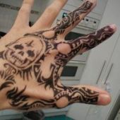 hand tattoo skull tribal